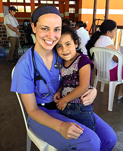 Dr. Hillary Carnell with a young patient on our Guatemala mission