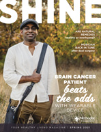 Spring 2021 Shine Magazine cover featuring a patient standing in a field holding a bag